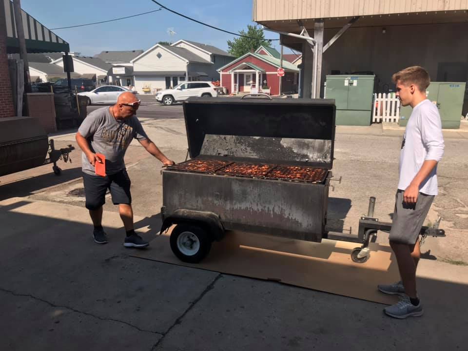 Two men grilling