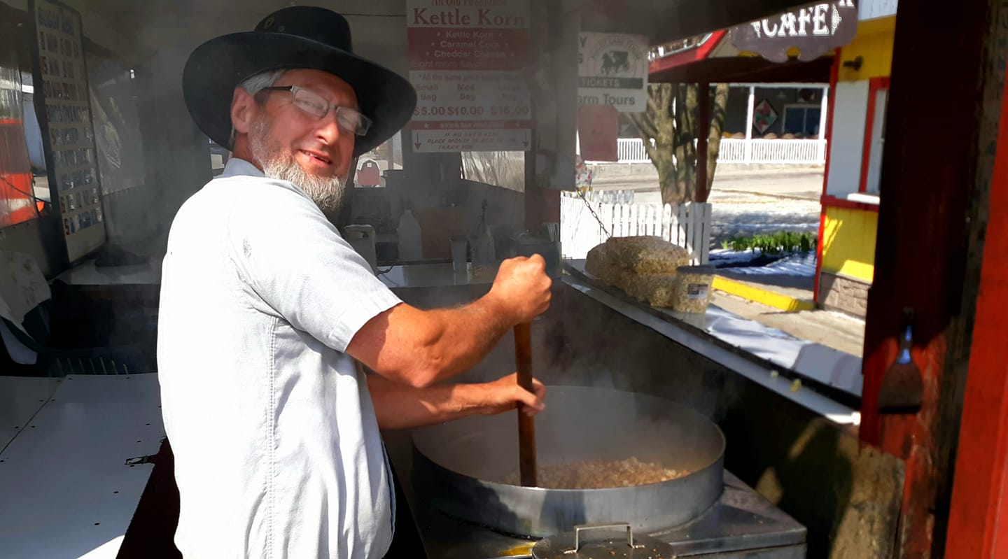 Amish man making kettle corn on the boardwalk.