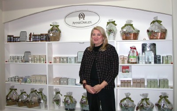 Woman standing in front of perfume display