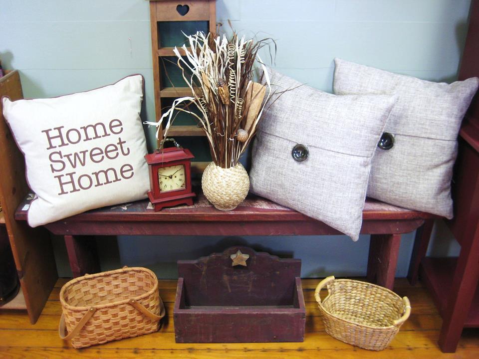 Pillows on bench with baskets