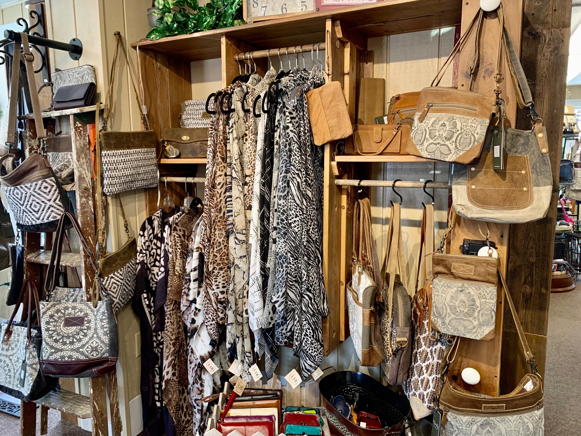 Clothing and bags on display in store