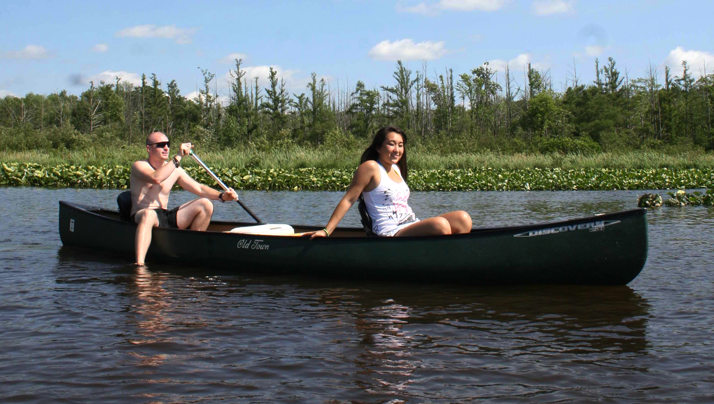 Two people in canoe on water