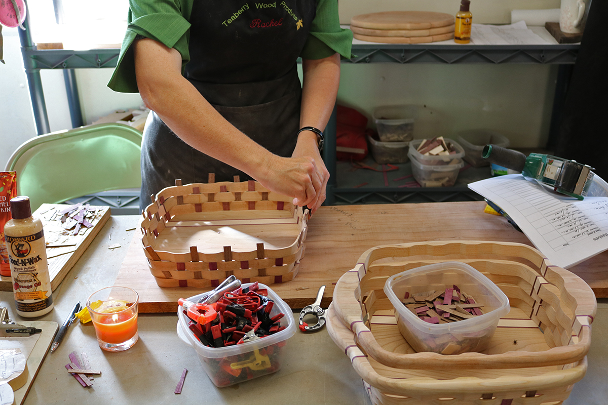 Person weaving a basket