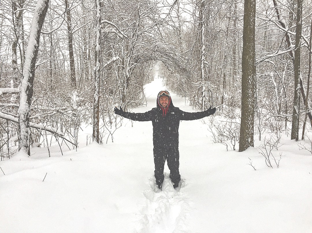 A person on a snowy forest trail