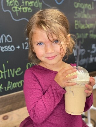 Child holding beverage