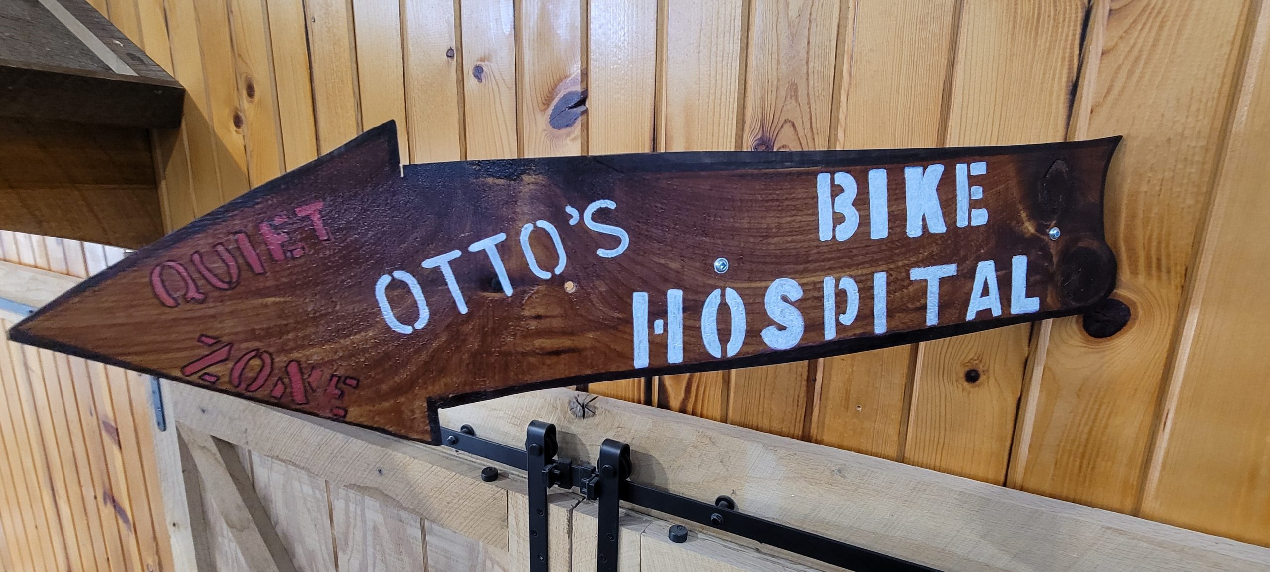 Otto's bike shop arrow sign